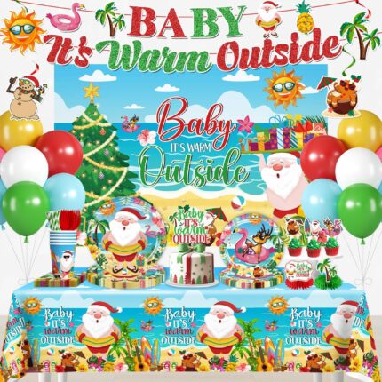 cocomigo Christmas in July party set with "Baby It's Warm Outside" banner, plates, cups, and tropical decorations.