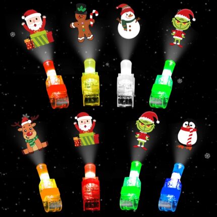 A hand wearing multiple colorful LED Christmas finger lights projecting festive images like Santa and snowmen in the dark.