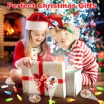 A hand wearing multiple colorful LED Christmas finger lights projecting festive images like Santa and snowmen in the dark.