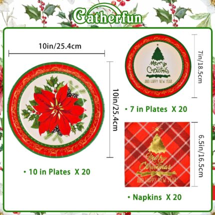 Red poinsettia patterned disposable dinner plates, dessert plates, and folded napkins for a Christmas party setting.