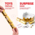 A close-up view of multiple gold snowflake Christmas party favors, some open revealing paper hats and small gifts.