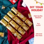 A close-up view of multiple gold snowflake Christmas party favors, some open revealing paper hats and small gifts.
