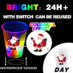 A set of 24 clear plastic 16oz mishunyus Christmas party cups with LED lights glowing, decorated with holiday stickers.