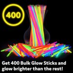 A large pile of PartySticks multi-colored glow sticks and connectors, glowing brightly against a dark background.