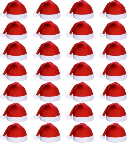 A large pile of 28 red and white plush Santa hats for adults, ready for a Christmas party.