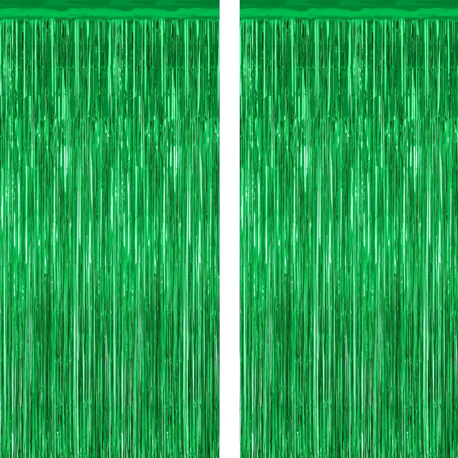 zataye-2-pack-green-metallic-foil-fringe-curtains-3-28-x-7-05-ft-tinsel-backdrop-01 Two shimmering green metallic foil fringe curtains hanging, ready for a party backdrop or festive decoration.